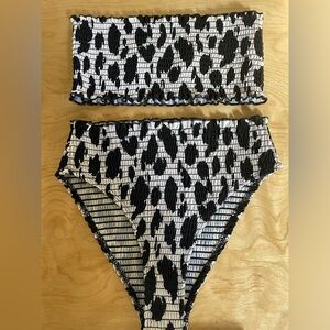Reformation bikini with cow spot print. Worn one time. Perfect condition.